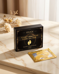 Collagen Gold Under-Eye Masks on marble with dried botanicals