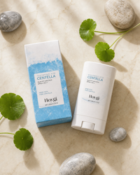 Silky-Fit Sun Stick SPF50+ hero with box and centella leaves